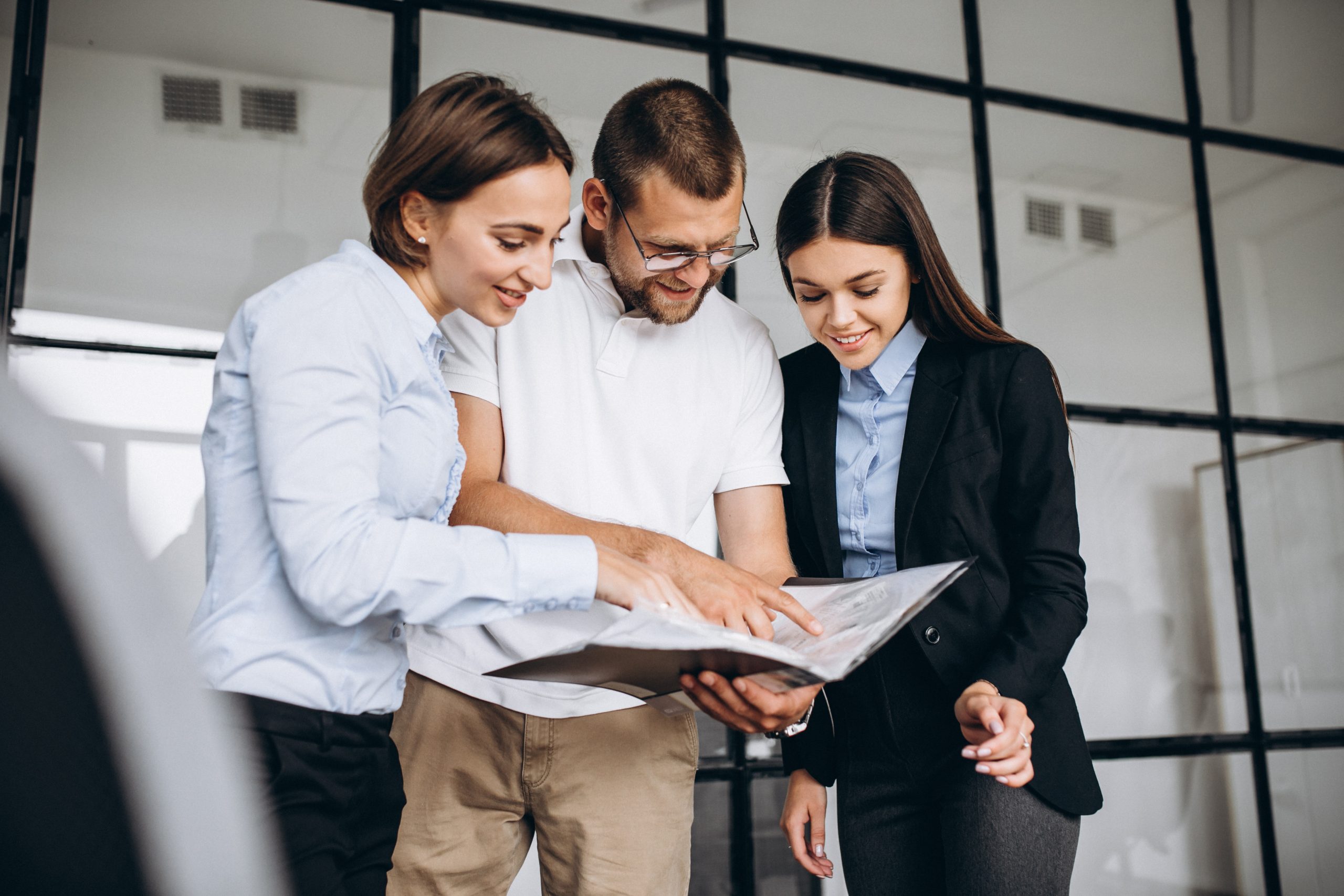 group of people working out business plan in an office